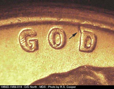 Die-stage B marker on 1960D•1MM•018 showing Die dent NW on D of GOD. 1960D-1MM-093 has almost the same location, without the die dent but the separation is a lit….