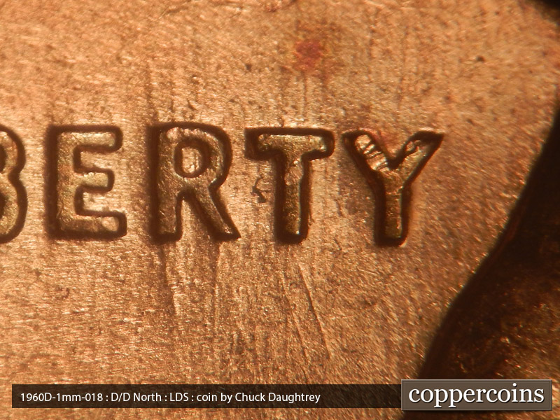 Die-stage C marker on 1960D•1MM•018 showing Remnants on old die scratches running N-S through the R in Liberty.