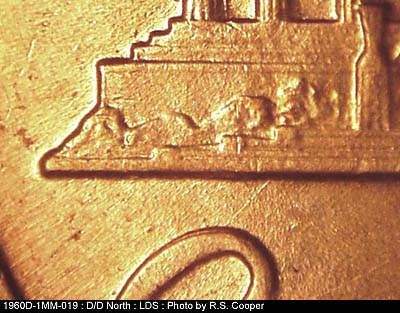 Die-stage C marker on 1960D•1MM•019 showing Small light SW die scratch from lower base to O on ONE.