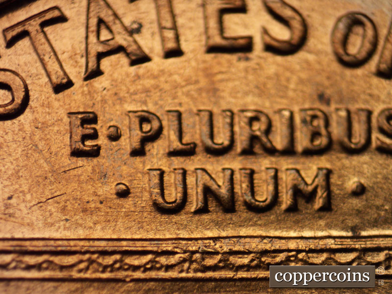 Die-stage B marker on 1960D•1MM•020 showing Light E/W die scratches through UNUM.