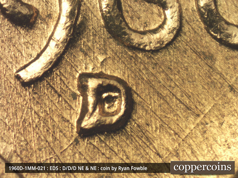 Die-stage A marker on 1960D•1MM•021 showing Closeup of repunched mintmark. Very heavy NW-SE die scratches run through the date.