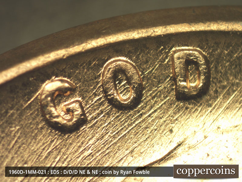 Die-stage A marker on 1960D•1MM•021 showing NE die scratches through GOD.
