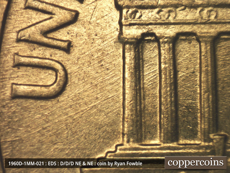 Die-stage A marker on 1960D•1MM•021 showing NE die scratches from rim through bays 1 and 2.
