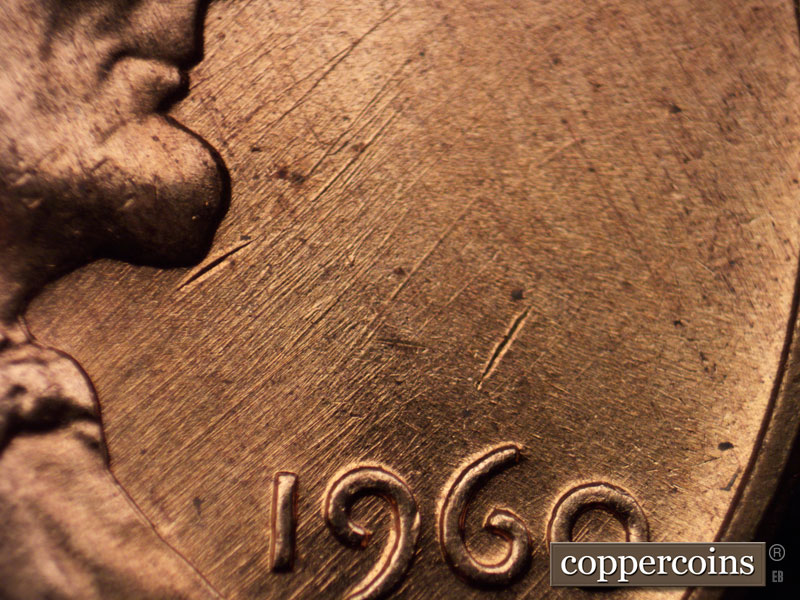 Die-stage A marker on 1960D•1MM•023 showing NE die scratches in throat area.