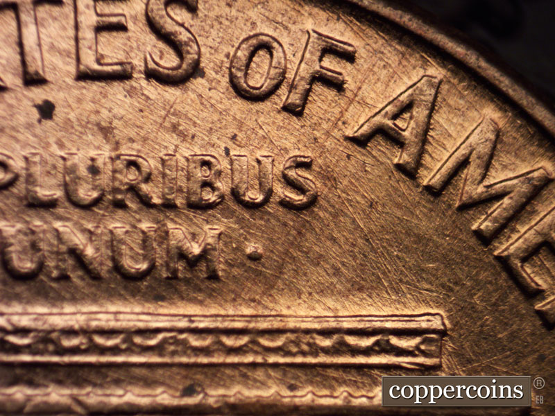 Die-stage A marker on 1960D•1MM•023 showing Multidirectional die scratches under AMERICA.