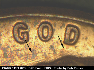 Die-stage B marker on 1960D•1MM•023 showing A die scratch under GOD.