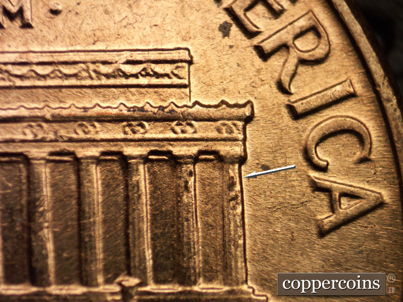 Die-stage C marker on 1960D•1MM•025 showing Die breaks column 11 and 12. ESE die scratch from dot toward E in AMERICA.