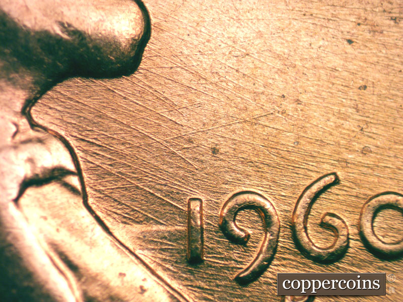 Die-stage B marker on 1960D•1MM•027 showing Die clash between bust and 1 in date. Die scratches through the date.