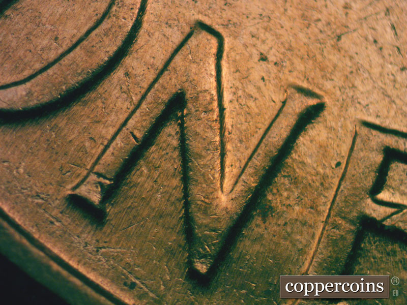 Die-stage B marker on 1960D•1MM•027 showing N in ONE.