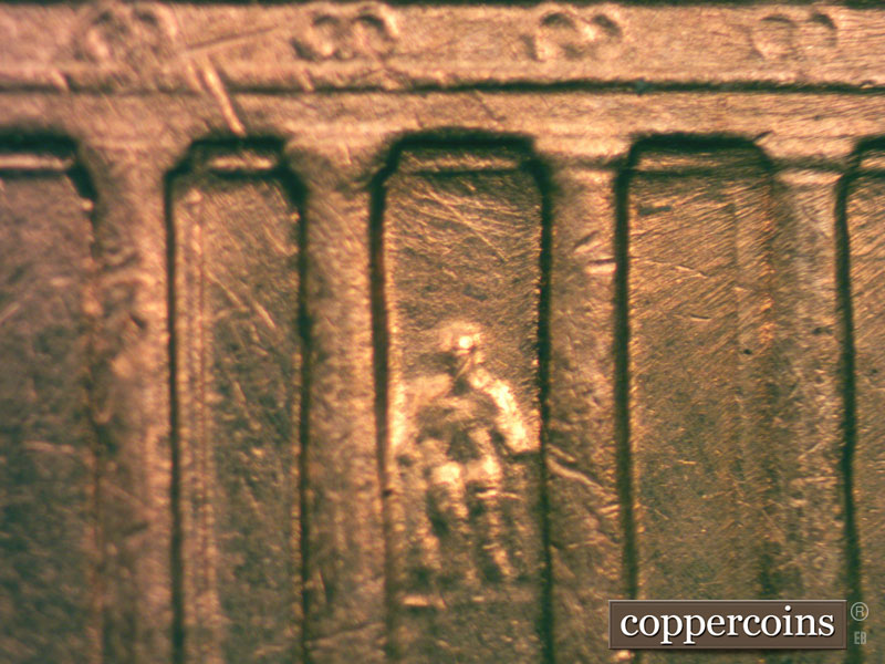 Die-stage B marker on 1960D•1MM•027 showing Die scratches in top of bay 6.