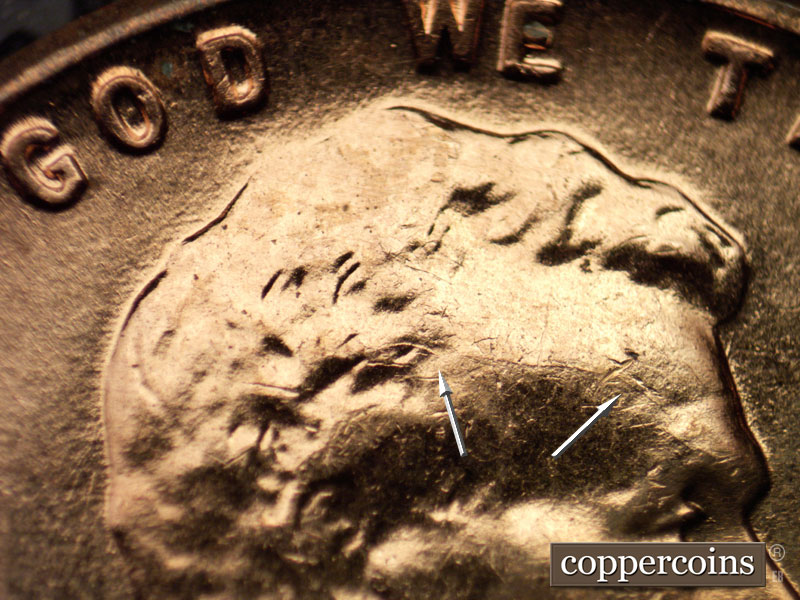 Die-stage A marker on 1960D•1MM•028 showing Die crack on forehead.