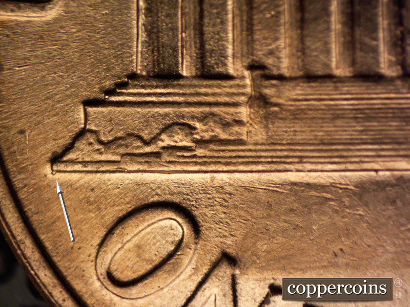 Die-stage A marker on 1960D•1MM•028 showing Die chip on left base tip.