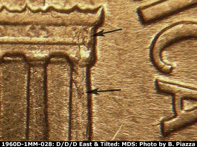 Die-stage B marker on 1960D•1MM•028 showing Die chipping on column 12 and right cornice.