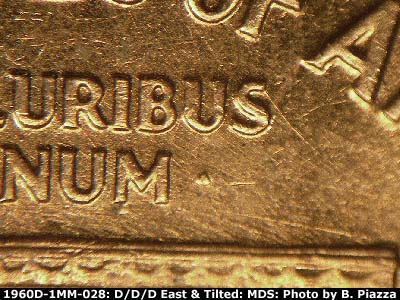Die-stage B marker on 1960D•1MM•028 showing Die scratches betweenroff and UNUM.