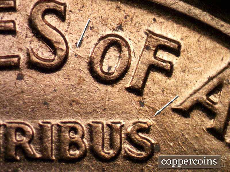Die-stage B marker on 1960D•1MM•029 showing Die scratch connects last S in STATES to o in OF. Die scratch connects F in OF to S in PLURIBUS.