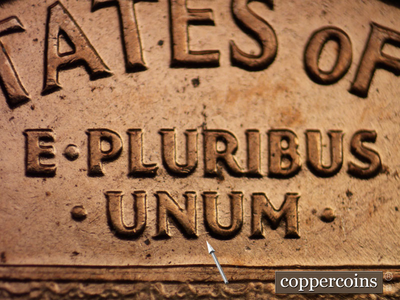 Die-stage C marker on 1960D•1MM•029 showing Die scratches connect NU in UNUM.