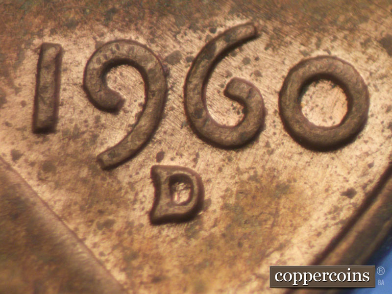 Die-stage A marker on 1960D•1MM•030 showing Numerous die polish lines above date and extending through 1960.
