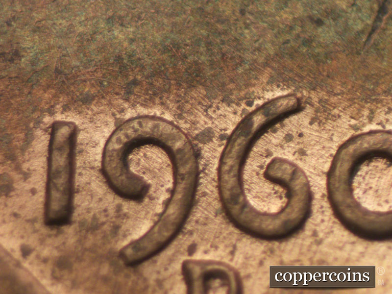 Die-stage A marker on 1960D•1MM•030 showing Numerous die polish lines above date and extending through 1960.