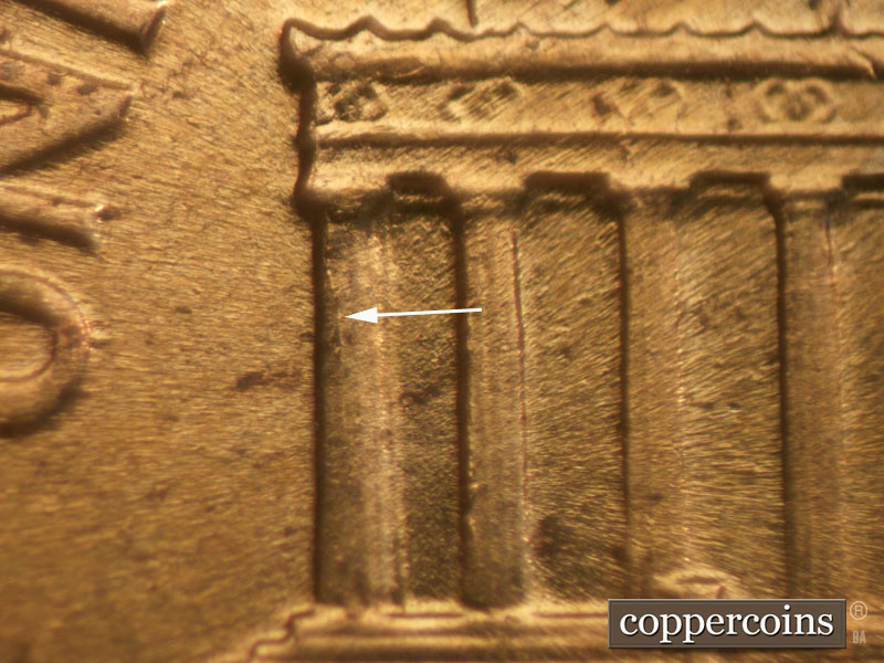 Die-stage C marker on 1960D•1MM•031 showing Die crack on column 1.