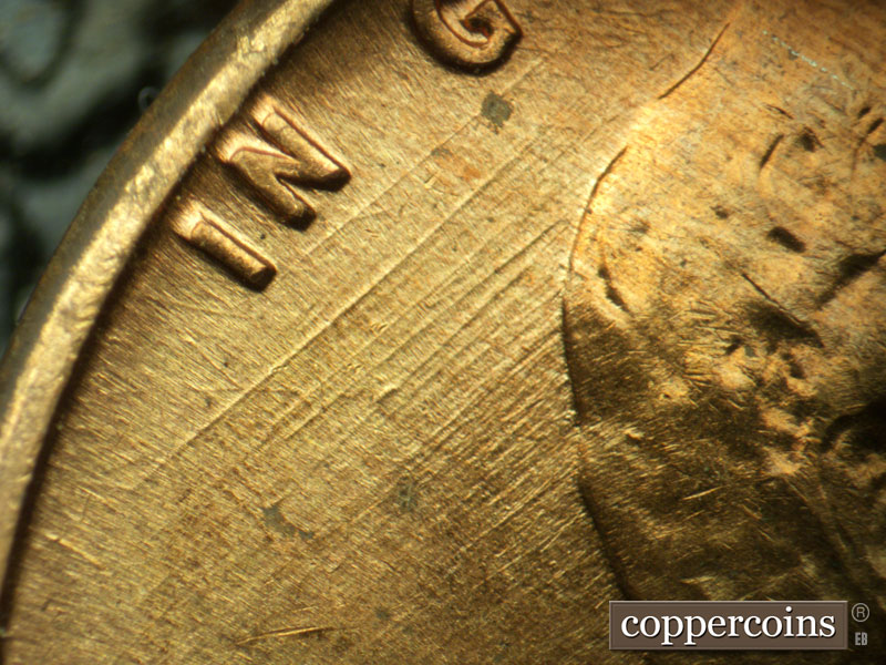 Die-stage A marker on 1960D•1MM•032 showing Heavy SW die scratches under IN GOD.