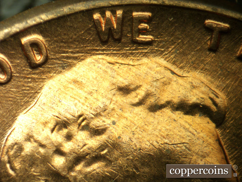 Die-stage A marker on 1960D•1MM•032 showing Die scratchess through WE.