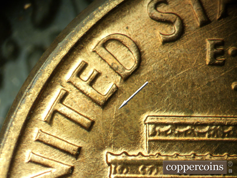Die-stage A marker on 1960D•1MM•032 showing Die scratch connect left cornice to D in UNITED.
