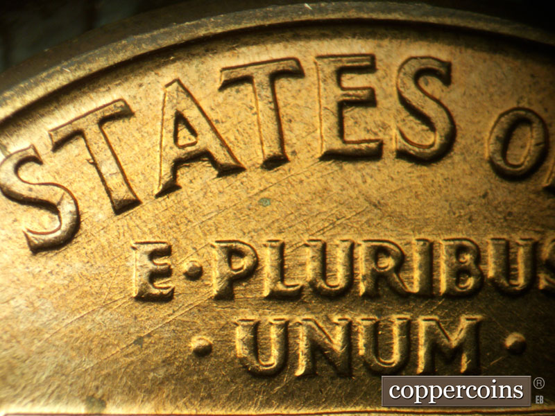 Die-stage A marker on 1960D•1MM•032 showing SW die scratches through STATES. E/W die scratches through E PLURIBUS UNUM.