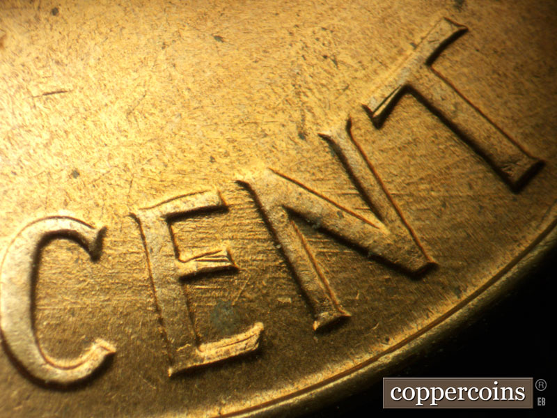 Die-stage A marker on 1960D•1MM•032 showing E/W die scratches through CENT.