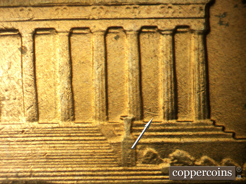 Die-stage A marker on 1960D•1MM•032 showing ESE die scratch in lower bay 10.