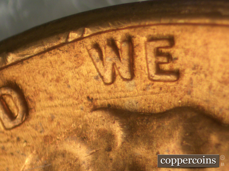 Die-stage B marker on 1960D•1MM•032 showing Parallel die scratches under WE.