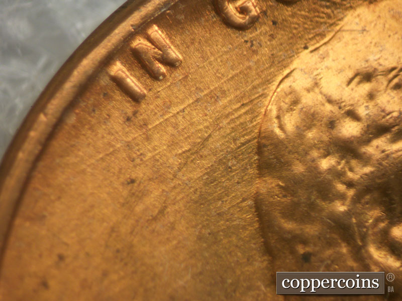 Die-stage B marker on 1960D•1MM•032 showing Parallel die scratches under IN GOD.