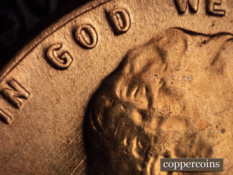 Die-stage C marker on 1960D•1MM•032 showing SE die scratch under GOD.