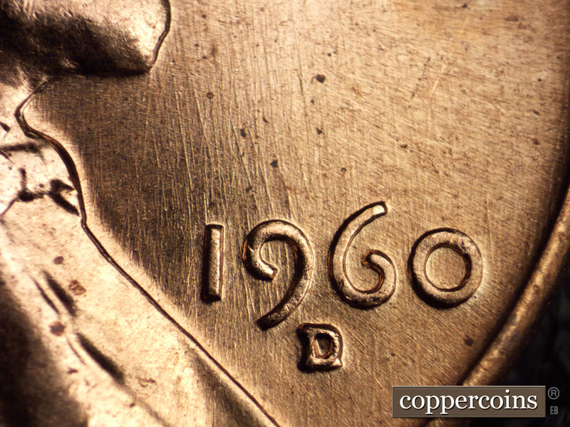 Die-stage A marker on 1960D•1MM•033 showing Generally N/S die scratches through date.