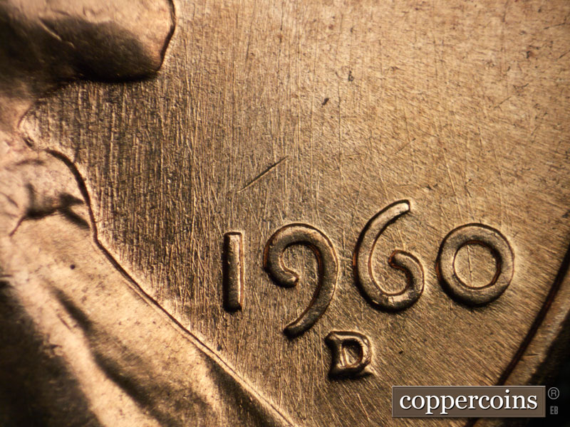Die-stage B marker on 1960D•1MM•033 showing N/S die scratches under chin through 19 in date.