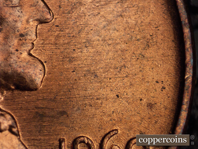 Die-stage B marker on 1960D•1MM•036 showing E/W die scratches above date.