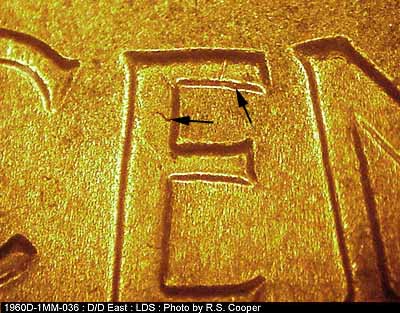 Die-stage C marker on 1960D•1MM•036 showing Die goouges on the upper E of CENT.