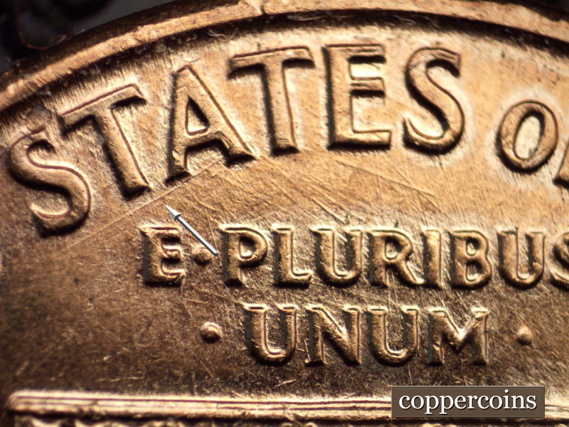 Die-stage B marker on 1960D•1MM•037 showing A strong die scratch below the STA of STATES.