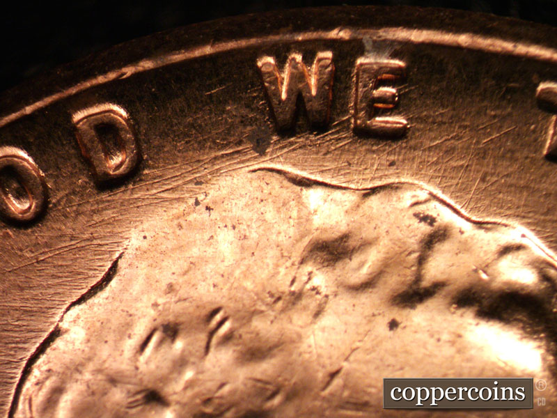 Die-stage C marker on 1960D•1MM•037 showing NE die scratch from under D in GOD to E in WE.