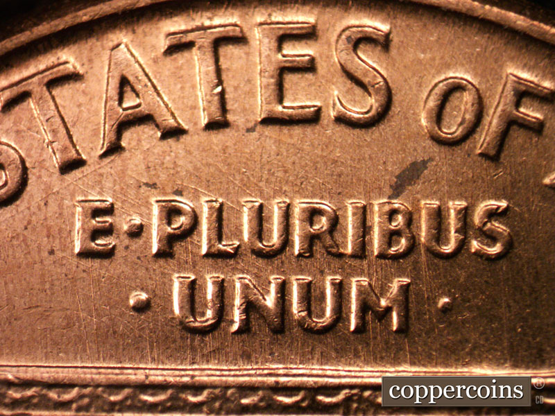 Die-stage C marker on 1960D•1MM•037 showing SE die scratch through LU in PLURIBUS.