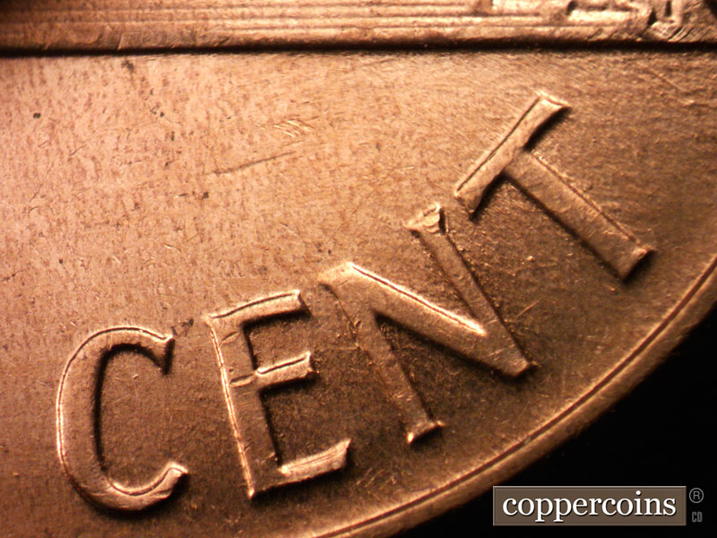 Die-stage C marker on 1960D•1MM•037 showing Worn SE die scratch from N in CENT.
