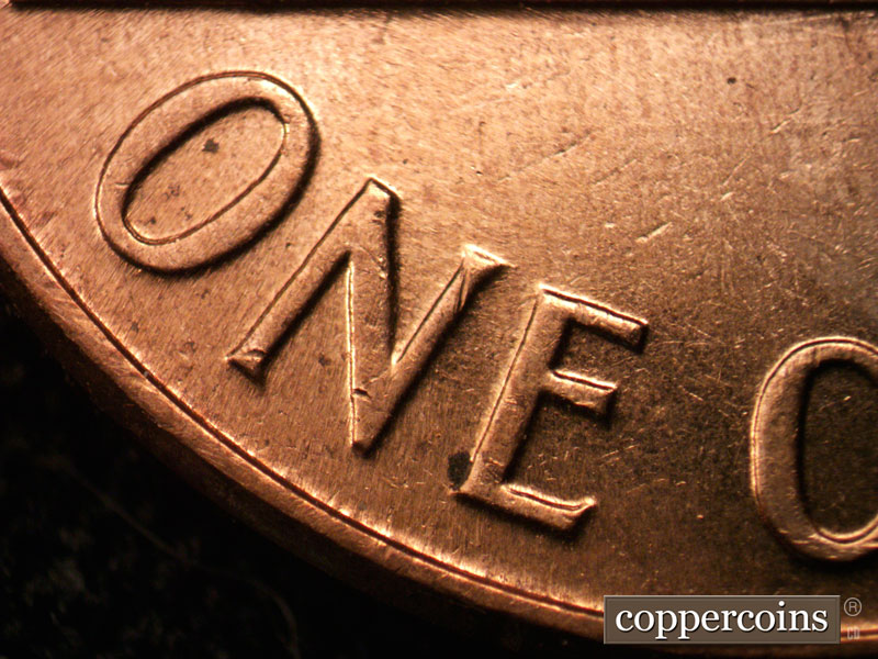 Die-stage C marker on 1960D•1MM•037 showing No die scratches through ONE as in stage B.