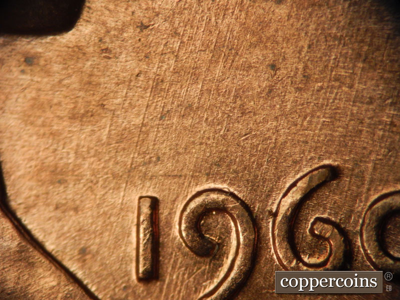 Die-stage B marker on 1960D•1MM•038 showing NNE die sccratches through date.
