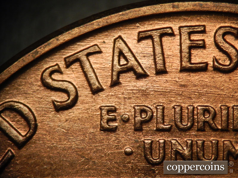 Die-stage B marker on 1960D•1MM•038 showing ESE die scratches though STATES and above E. PLURIBUS.