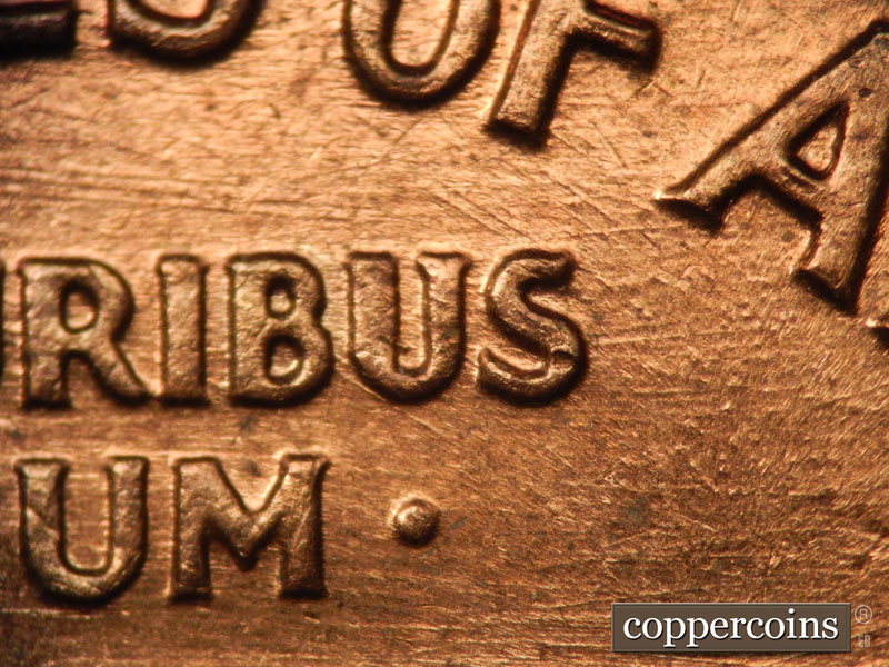 Die-stage B marker on 1960D•1MM•038 showing ESE die scratches though STATES and above E. PLURIBUS.