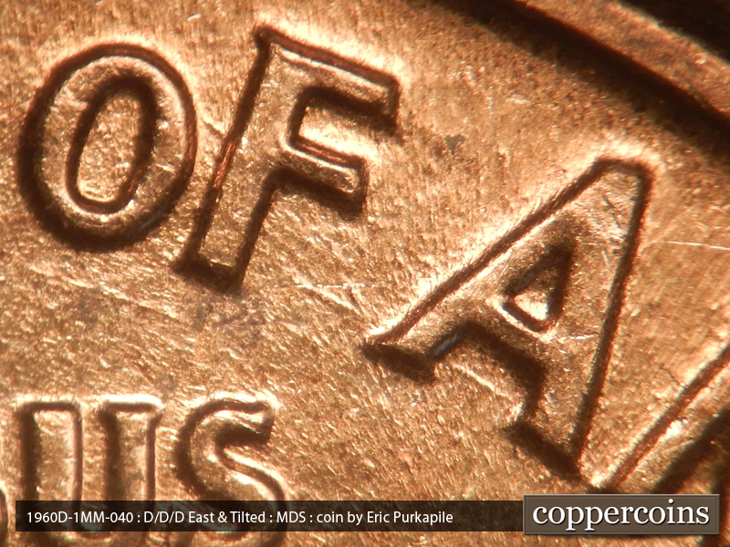 Die-stage B marker on 1960D•1MM•040 showing SE die scratch from F in OF to first A in AMERICA.