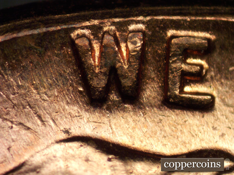 Die-stage C marker on 1960D•1MM•040 showing Die dot near W in WE.