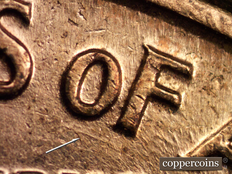 Die-stage C marker on 1960D•1MM•040 showing Die gouge under OF.