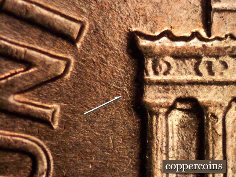 Die-stage C marker on 1960D•1MM•040 showing NW die scratch from column 1.