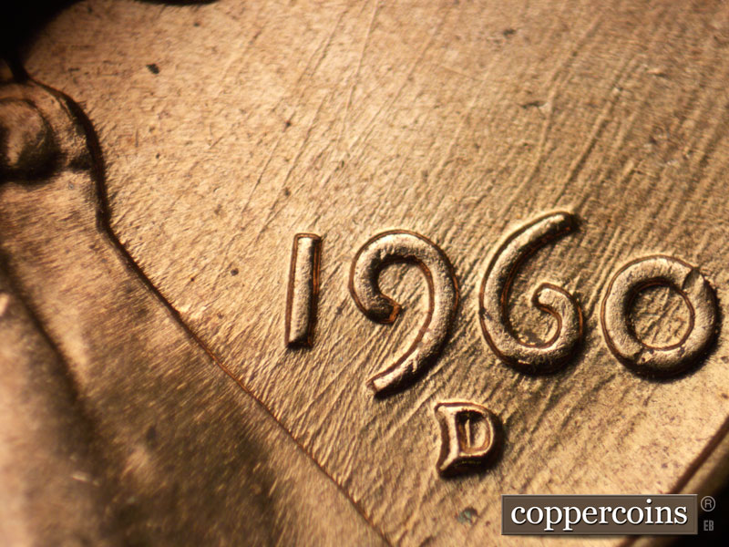 Die-stage B marker on 1960D•1MM•042 showing Many generally SW/NE die scratches through date.