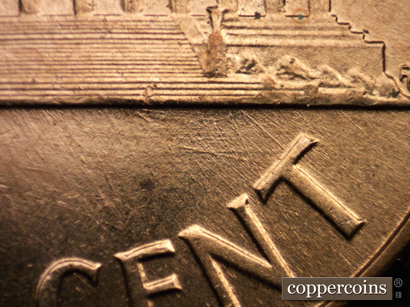 Die-stage B marker on 1960D•1MM•042 showing Die scratches running mainly NW-SE show around the T of CENT.